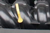 Hyundai i20 oil dipstick and engine oil filler cap inside the engine bay
