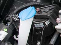 Hyundai i20 screen wash reservoir inside the engine bay