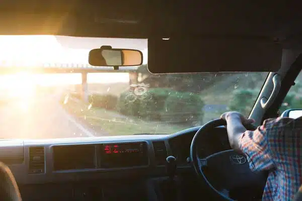 Driver affected by bright summer sun glare