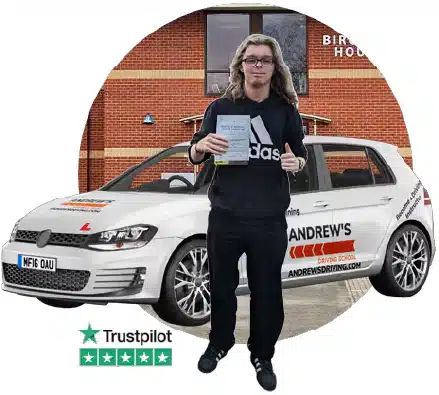 Learner standing with an Andrew’s Driving School car outside Wrexham Driving Test Centre