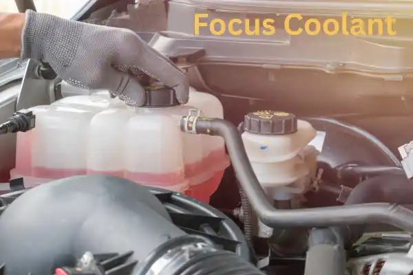 Ford Focus coolant expansion tank inside the engine bay