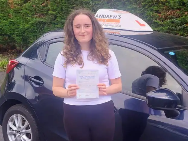 India in Rhyl showing off her new driving test pass certificate