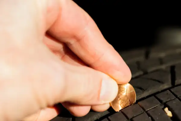 Checking tyre tread depth using a 20p coin