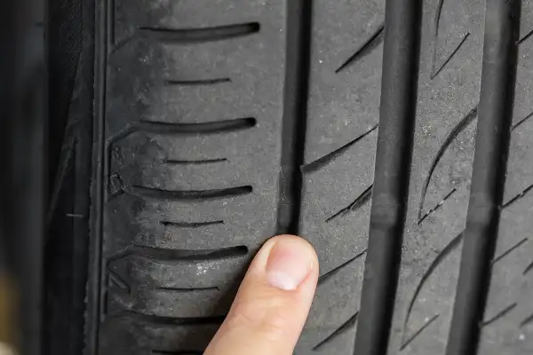 Tread wear indicator inside the groove of a car tyre