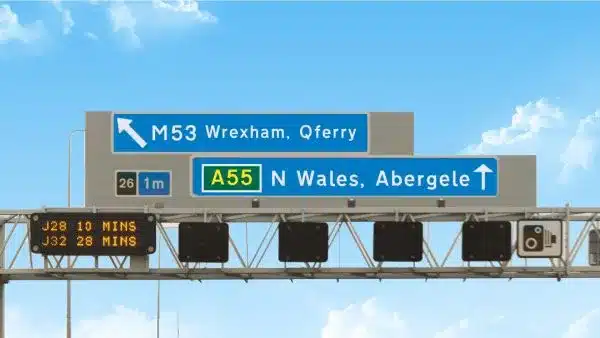 Motorway overhead gantry displaying lane directions and traffic information