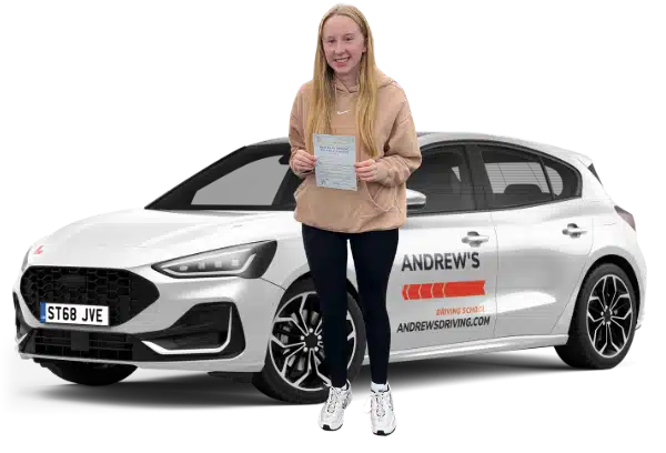 Chana from Llandudno Junction holding her driving test pass certificate beside an Andrew's Driving School car
