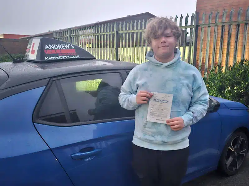 Daniel from Prestatyn in Rhyl Test Centre with his driving instructors car