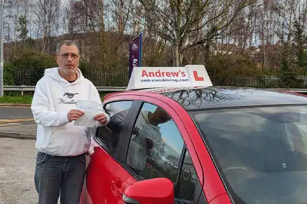 Successful learner celebrating a driving test pass