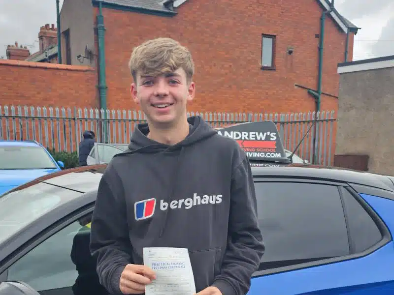 Owen in the Driving Test Centre with his pass certificate