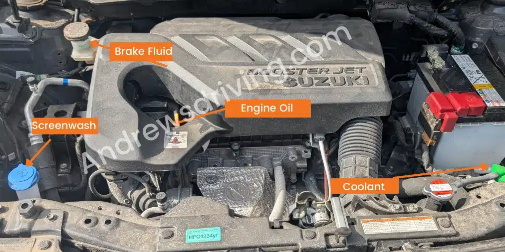 Suzuki Swift 1.0 Boosterjet engine bay showing the location of the brake fluid, screen wash, engine oil and coolant