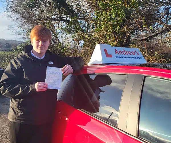 "Brychan leaning on Claire's Auto car in Colwyn Bay with his new pass certificate"