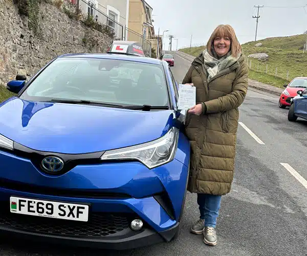 "Claire on the Great Orme in Llandudno with Fiona's Andrew's Driving School car and her pass"