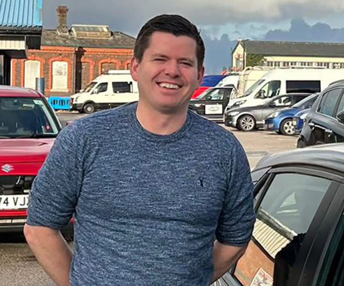 Geraint Jones beside his car after passing the ADI qualification tests