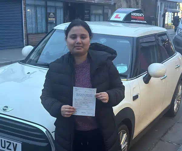 Halima with her driving test pass in Rhyl