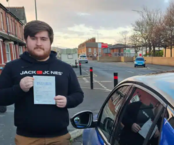 James with his pass certificate on Victoria Road Rhyl