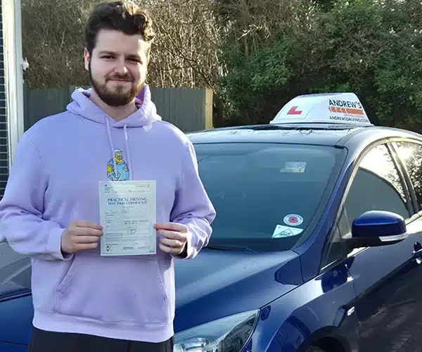 "Joseph in front of Craigs car branded with Andrew's Driving at the Wrexham Driving Test Centre"