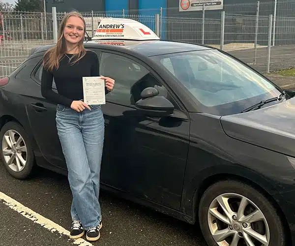 Rhianan celebrating a driving test pass in Anglesey with Andrew's Driving School