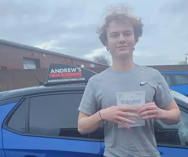 Rowlands celebrating a driving test pass in Rhyl with Andrew's Driving School