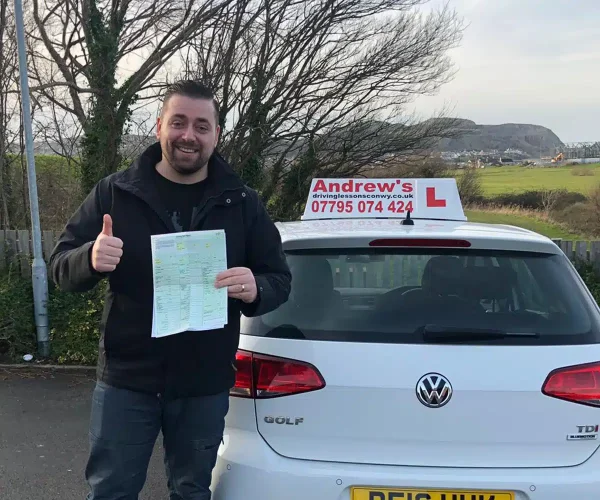 Tomas Kapus holding his ADI Part 3 pass certificate
