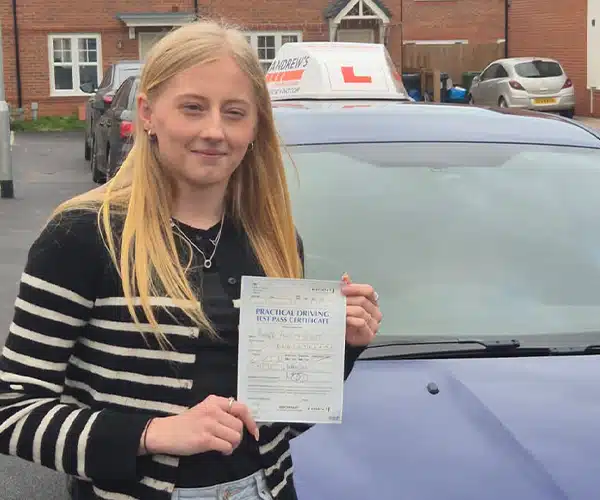 "Amber at Werxham Driving Test Centre with her driving test pass certificate, standing by Craig's Car"