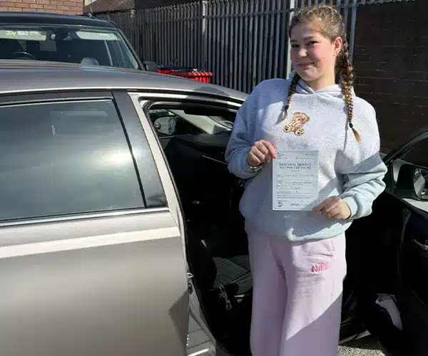 Young lady outside the Rhyl Driving Test Centre