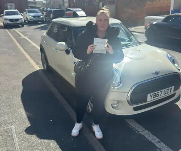 Jadden in Rhyl after passing the automatic driving test with Jimmy Garland