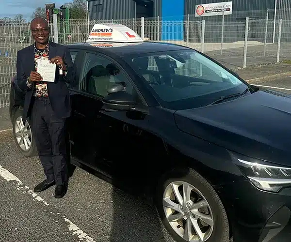 Matthew from Holyhead at The Bangor Driving Test Centre with Geraint Jones tuition car