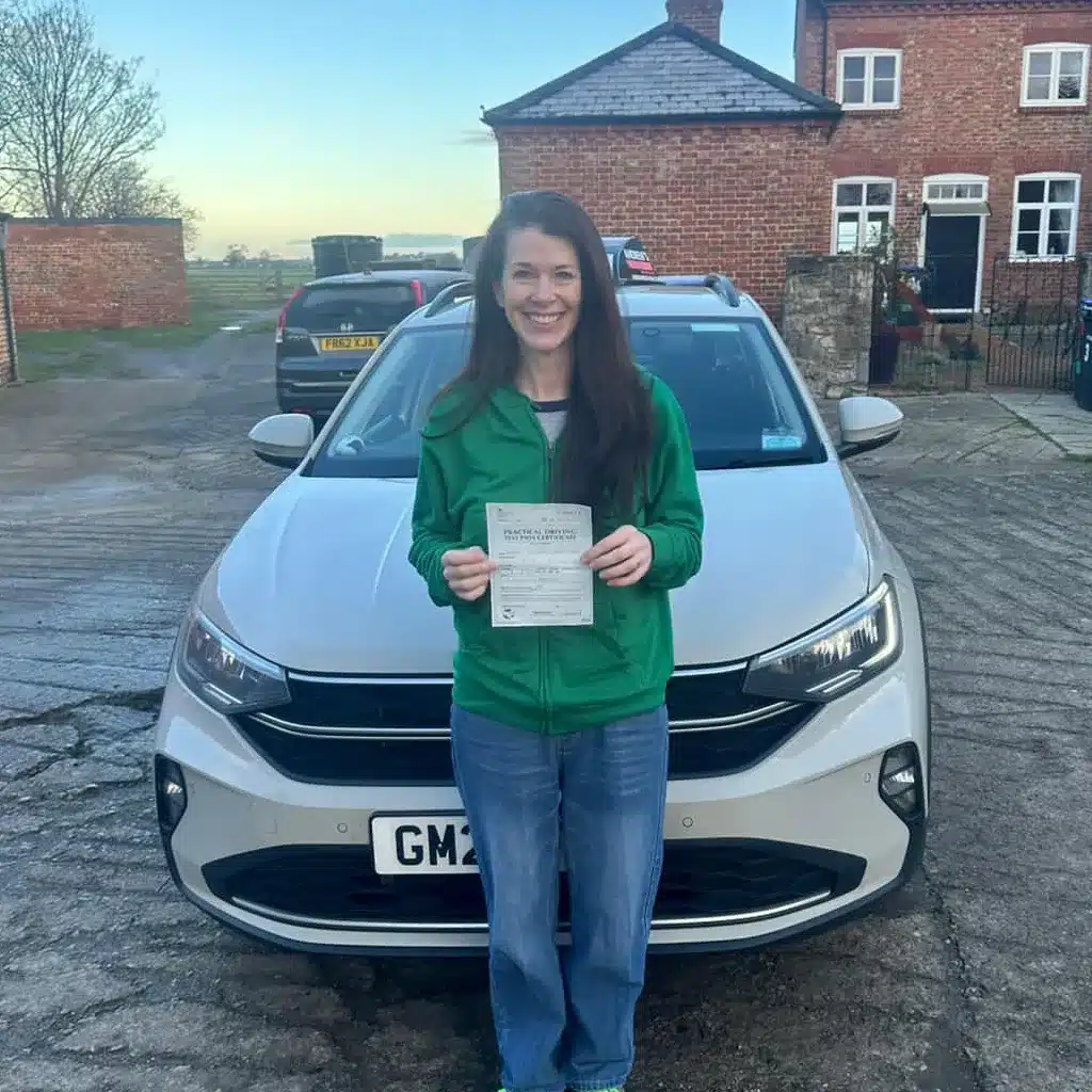Learner celebrating after passing their driving test in Telford