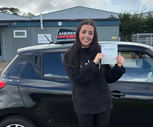 Kelsi celebrating a driving test pass in Bangor with Andrew's Driving School