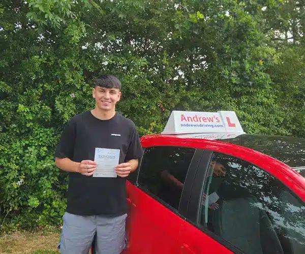 Brad celebrates passing his automatic driving test first time with instructor Claire from Andrew's Driving School.
