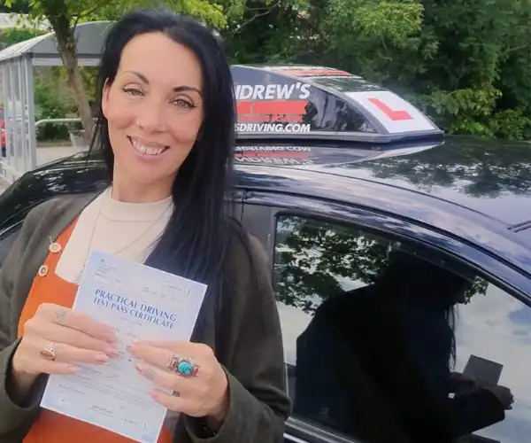 Joanne Davies from Denbigh celebrates passing her driving test first time in Rhyl with instructor Mark Bilton from Andrew's Driving School.