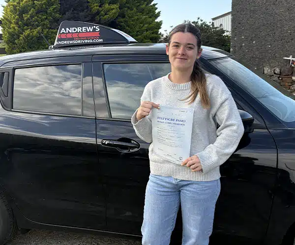 Lwsi Jones celebrates passing her driving test in Bangor with Andrew's Driving School.