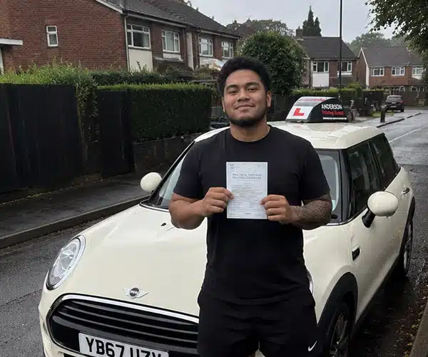Sonny celebrates passing his driving test first time with instructor Jimmy from Andrew's Driving School.