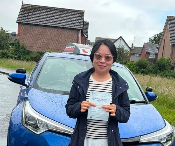 Sophie celebrates passing her automatic driving test in Rhyl with Andrew's Driving School.